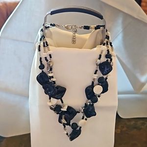 Black & White beaded necklace like new. Three strand.